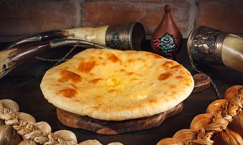 Imeruli Khachapuri - Georgian dish at Tbilisuri Ezo restaurant in Tbilisi }}