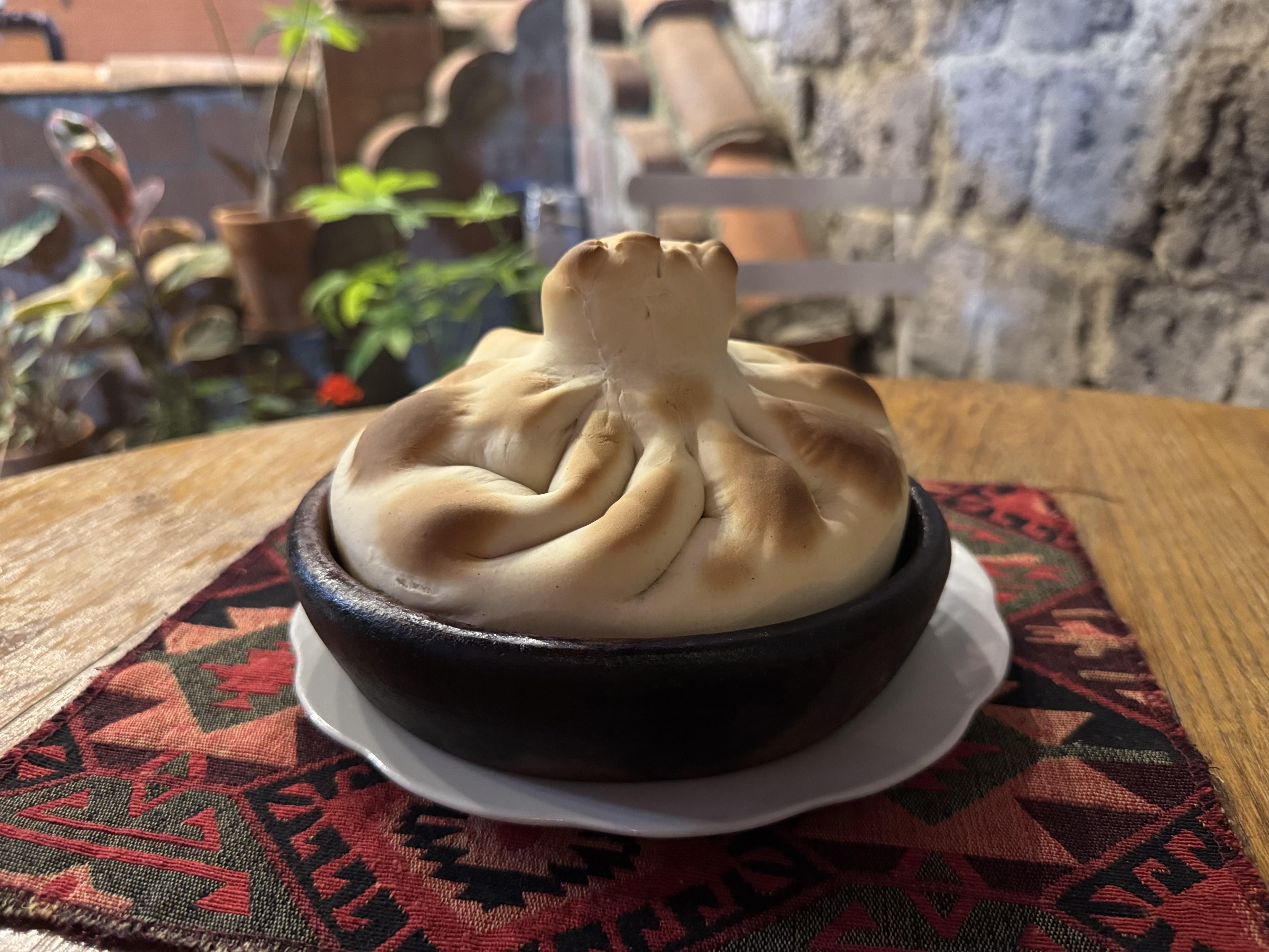 Branded Chashushuli in Khinkali on Ketsi - Georgian dish at Tbilisuri Ezo restaurant in Tbilisi }}